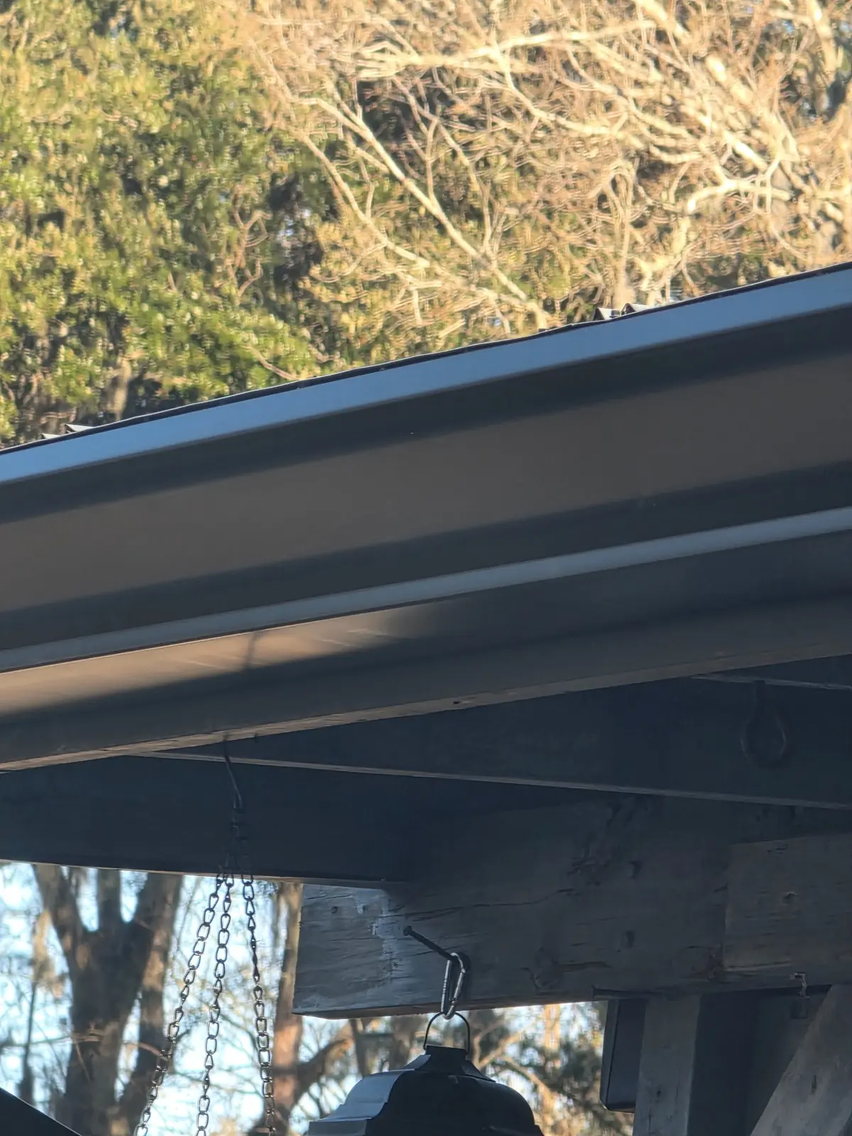 Gutter installed along the edge of a residential roof