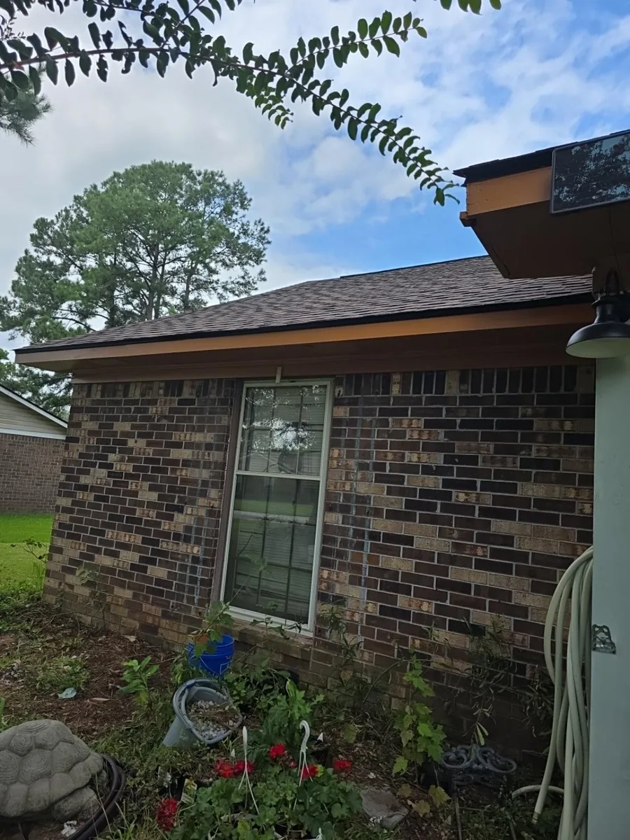 Shingle roof and fascia above a brick exterior in Indian Woods, Summerville.