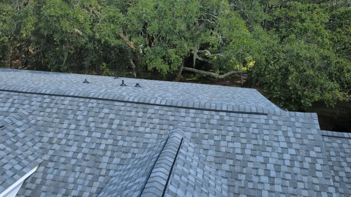 Architectural shingle roof with capped ridges and pipe boots, photographed on a HopeStar Roofing project.