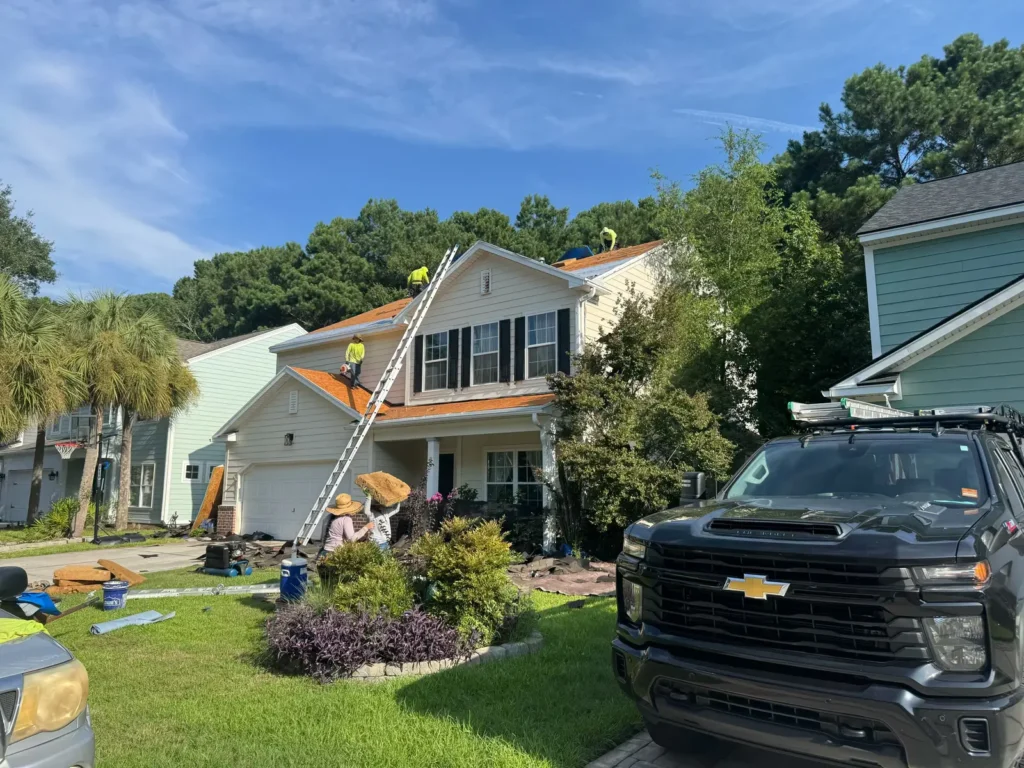 HopeStar Roofing crew completing roof tear-off after solar panel removal in the Lowcountry